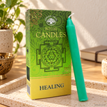 Set 10 Candele per rituali - Guarigione, con confezione originale e candela, ambientato su un piano in pietra.